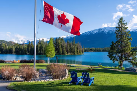 national-flag-canada-with-mountain-forest-jasper-national-park-summer-landscape-lac-beauver_363815-4351
